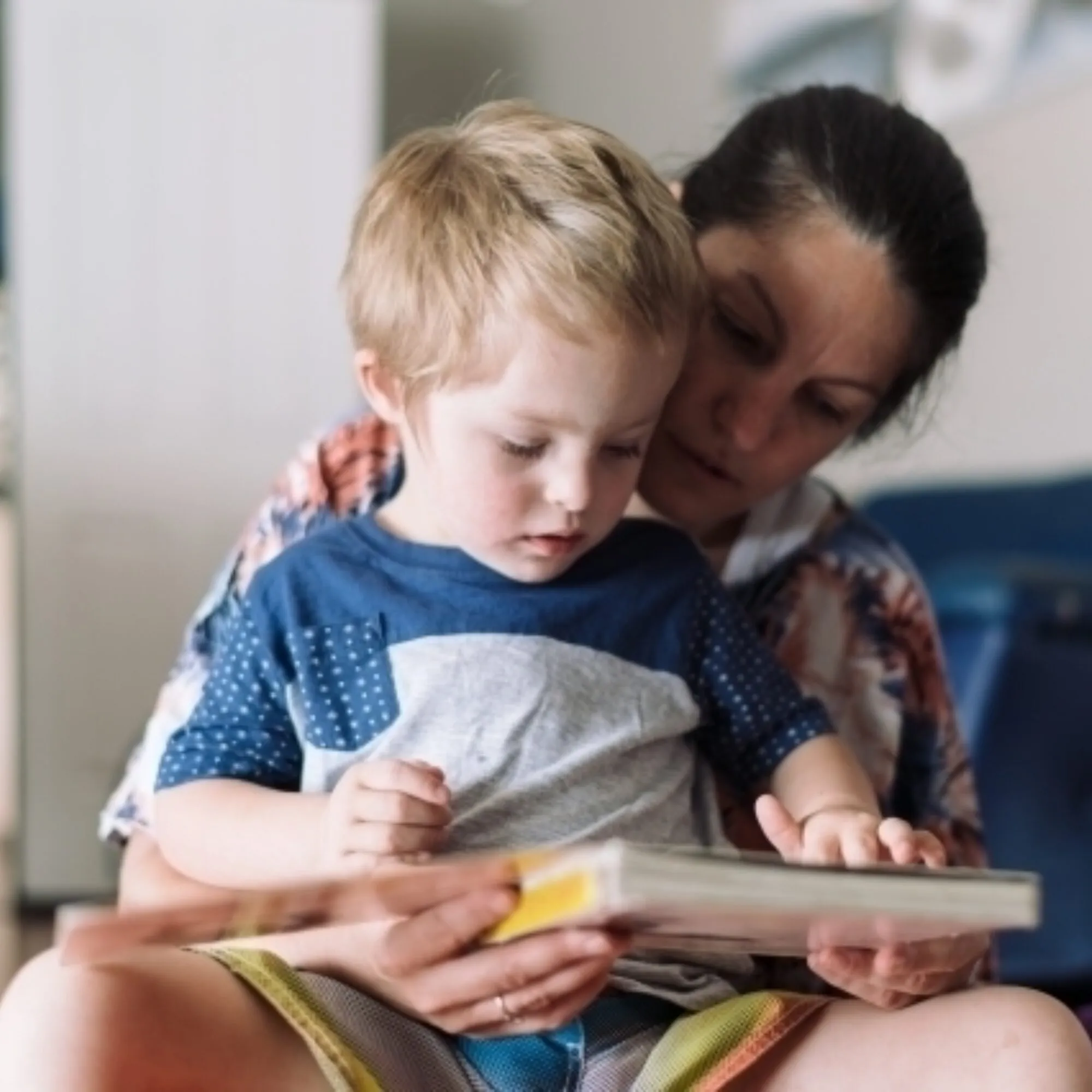 Mother reading to her child on the floor austockphoto 000002725